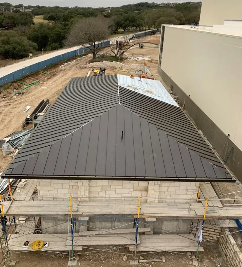 Metal roof new construction with scaffolding in Pelham